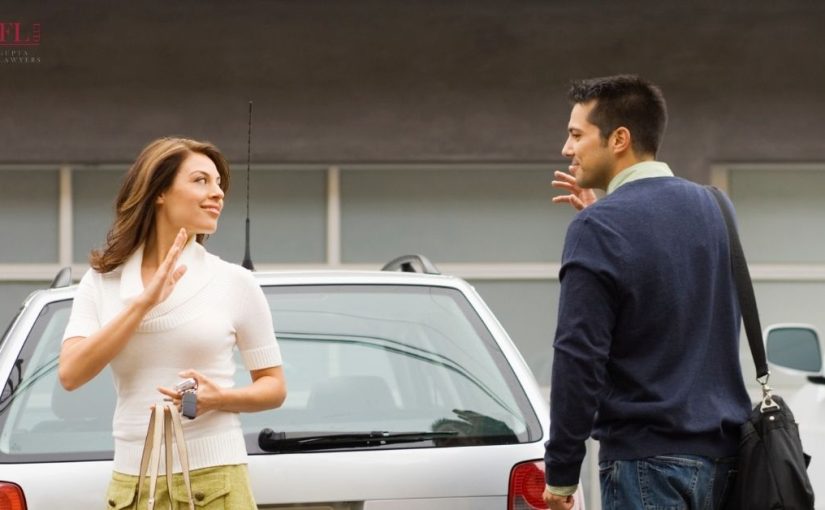 man and woman waving at eachother